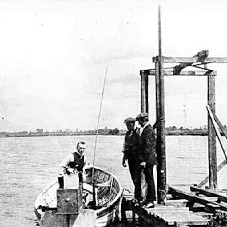 Members of the Royal Aeronautical Society with a radio controlled boat on Dagenham Breach in about 1909.